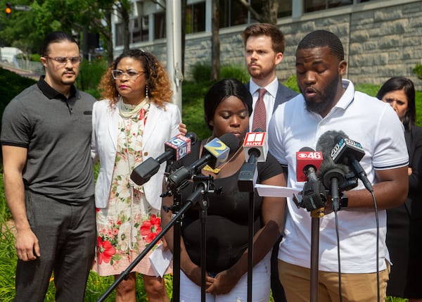 Johnny Bolton's son Kyrie Turner and daughter Diamond Bolton speak at a press conference in front of the Cobb County sheriff's office in Marietta on Tuesday, May 25, 2021.   STEVE SCHAEFER FOR THE ATLANTA JOURNAL-CONSTITUTION