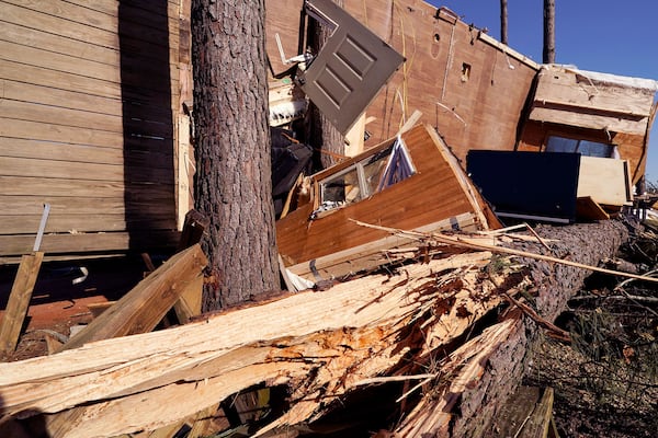 The frame of this mobile home is wrapped around a tree following Saturday's tornado that struck the Paradise Ranch RV Resort in Tylertown, Miss., Sunday, March 16, 2025. (AP Photo/Rogelio V. Solis)