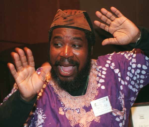 971214: ATLANTA, GA: Story-teller Akbar Imhotep entertains children with African tales during the Atlanta Association of Black Journalists' annual Kwanzaa Festival held at the Herndon Plaza on Sunday, December 14, 1997. The festivities included a Kwanzaa ceremony, an art auction and a fashion show. (Special to the AJC/Laura Noel)