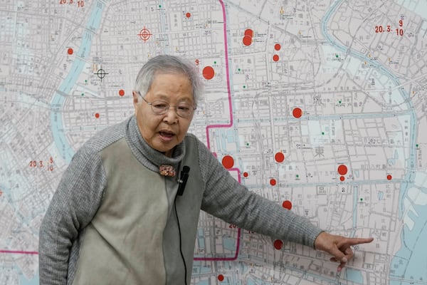 Shizuyo Takeuchi, 94-year-old Tokyo raid survivor, shares her experience in front of a map of the areas damaged during the 1945 Tokyo Firebombing at the Center of the Tokyo Raids and War Damage on Feb. 24, 2025, in Tokyo. (AP Photo/Eugene Hoshiko)