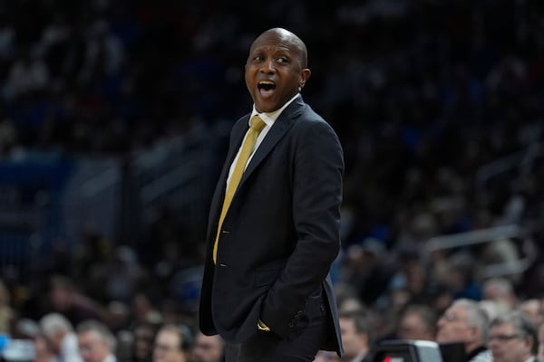 Missouri head coach Dennis Gates talks to his players during the first half of the first round against Drake of the NCAA college basketball tournament, Thursday, March 20, 2025, in Wichita, Kan. (AP Photo/Charlie Riedel)