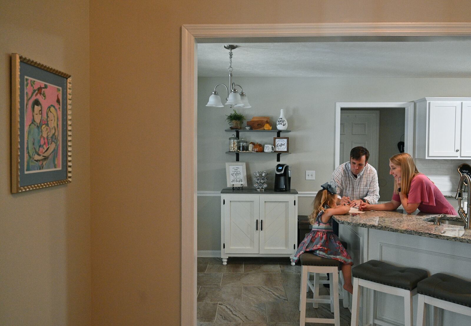 Kyndal Nipper and her husband Thomas play with their daughter Blakeley at their Midland home. Kyndal says that when she was diagnosed with COVID-19, at first she didn't panic because she didn’t feel that sick. ”What I didn’t realize was COVID was attacking me from the inside,” she said. Her doctor says that the virus ultimately cut off blood, oxygen and nutrients to her unborn baby Jack. (Hyosub Shin / Hyosub.Shin@ajc.com)