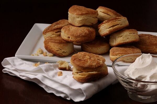 Baking the biscuits in a heavy cast-iron skillet gives them a delicious crisp crust with a super tender interior. (Mark Graham / food styling) (E. Jason Wambsgans/Chicago Tribune/TNS)