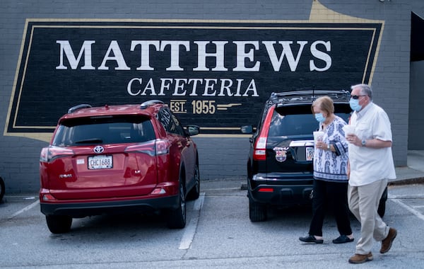 200717-Tucker-Customers leave Matthews Cafeteria on Main Street in Tucker on Friday afternoon July 17, 2020. The dining institution, established in 1955, ask customers to wear masks, added the acrylic dividers, made separate entrance and exit doors and have drive-up service.  Ben Gray for the Atlanta Journal-Constitution