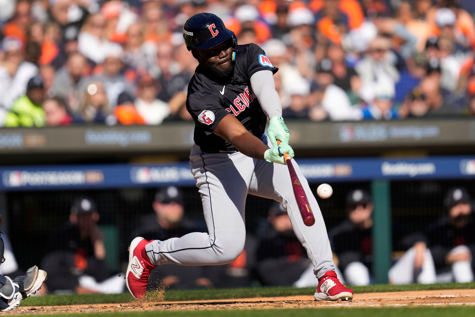 Cleveland Guardians' Jhonkensy Noel hits a sacrifice fly ball in the second inning during Game 3 of a baseball American League Division Series against the Detroit Tigers, Wednesday, Oct. 9, 2024, in Detroit. (AP Photo/Paul Sancya)