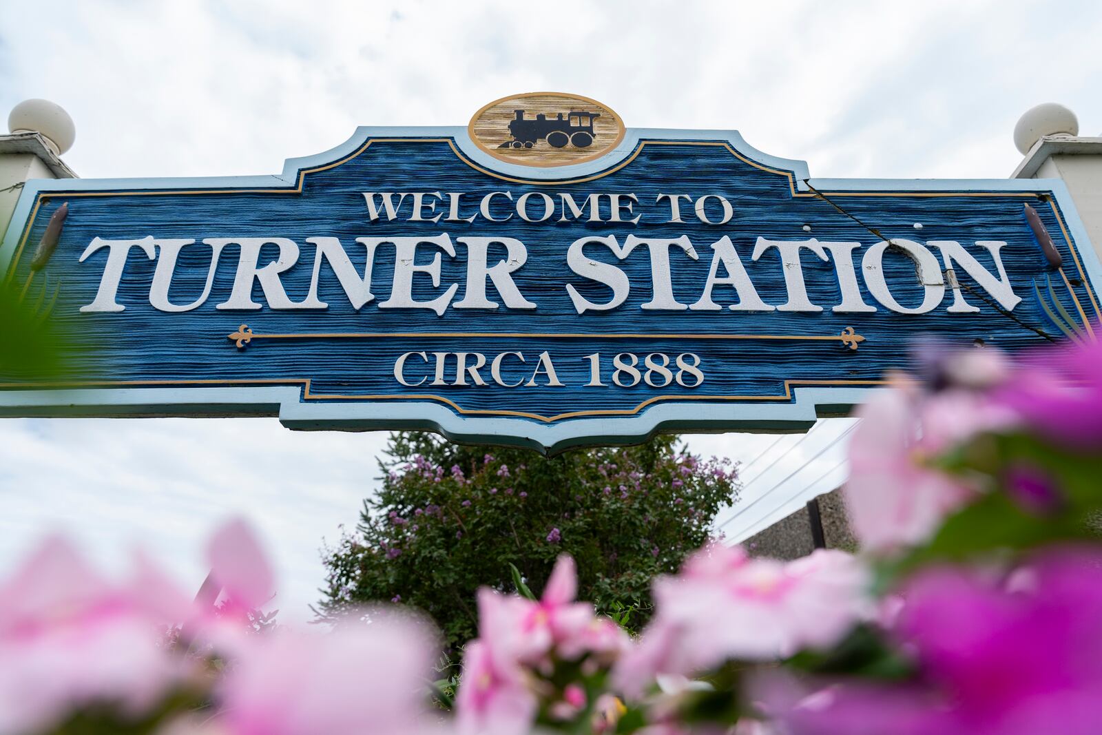 A community welcome sign on the corner Main Street and Dundalk Avenue is pictured, Friday, Aug. 16, 2024, in Turner Station, Md. (AP Photo/Stephanie Scarbrough)