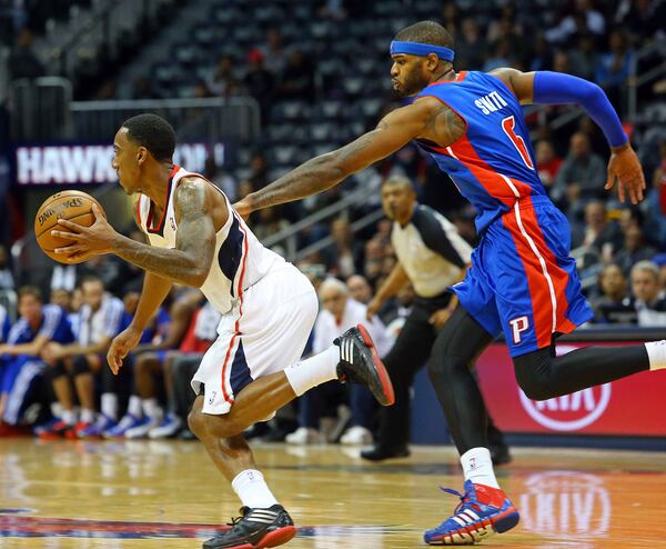 112013 ATLANTA: Hawks guard Jeff Teague breaks away from Pistons forward Josh Smith on the way to a 93-85 Hawks victory during the second half of their NBA basketball game in Smith's first return home against his former team on Wednesday, Nov. 20, 2013, in Atlanta. CURTIS COMPTON /staff CCOMPTON@AJC.COM Josh Smith, shown chasing Jeff Teague in a game last season, returned to Atlanta for an exhibition game Saturday.