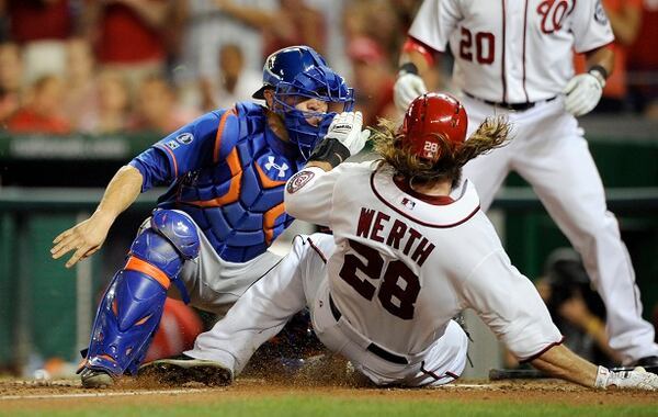 Washington Nationals' Jayson Werth (28) is tagged out at the plate by New York Mets catcher Travis d'Arnaud, left, during the sixth inning of a baseball game, Tuesday, Aug. 5, 2014, in Washington. (AP Photo/Nick Wass) Out at home: The Nats' Jayson Werth is thwarted. (Nick Wass/AP)