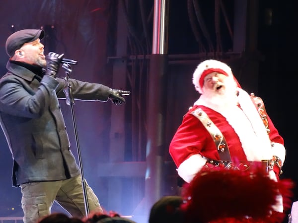 Bart Millard of MercyMe yuks it up with Santa at the Macy's Tree Lighting Sunday night. CREDIT: Rodney Ho/rho@ajc.com