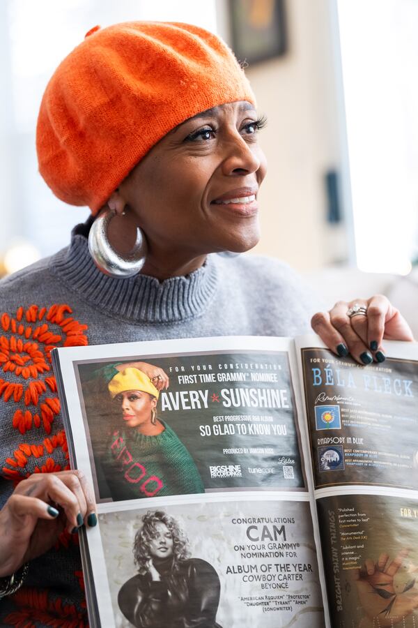 Veteran R&B singer Avery Sunshine proudly holds a copy of Billboard magazine that features her in the Grammy voting guide. (Bita Honarvar for the AJC)