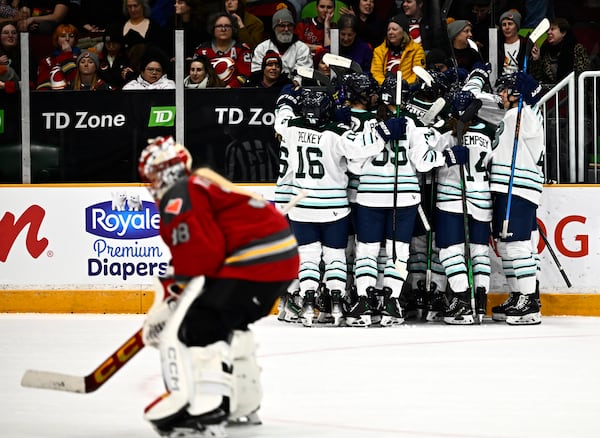 Ottawa Charge goaltender Emerance Maschmeyer (38) skates off the ice as the Boston Fleet celebrate the game winning goal of Susanna Tapani (77) during overtime period PWHL hockey action in Ottawa, on Thursday, Feb. 20, 2025. (Justin Tang/The Canadian Press via AP)