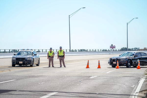 Florida State Troopers block traffic over the Bayou Grande Bridge leading to the Pensacola Naval Air Station following a shooting Friday in Pensacola, Fla.  (Photo by Josh Brasted/Getty Images)