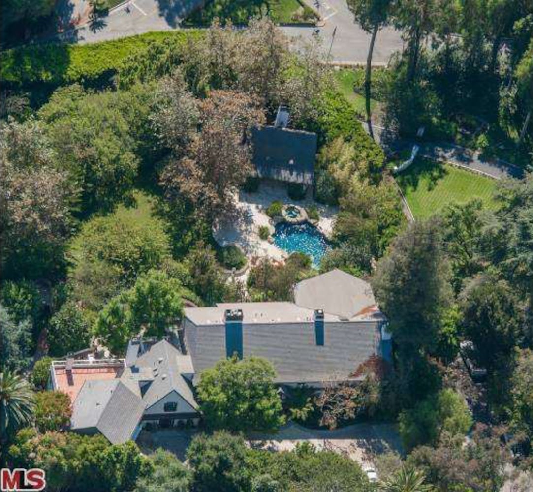 Property includes Mediterranean-style home, lagoon pool