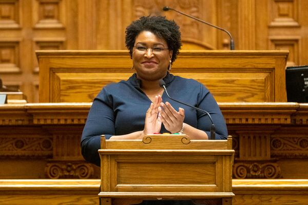 12/14/2020   Atlanta, Georgia   Georgia Democrat Stacey Abrams joins in applause after she and other members of Georgias Electoral College cast their ballots in the Georgia Senate Chambers at the Georgia State Capitol building in Atlanta, Monday, December 14, 2020.  (Alyssa Pointer / Alyssa.Pointer@ajc.com)