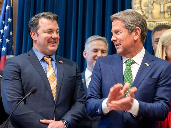 Lt. Gov. Burt Jones, left, says he is friends with both Gov. Brian Kemp, center, and former President Donald Trump. "While I always want my friends to be friends," he said, "that doesn't always happen."