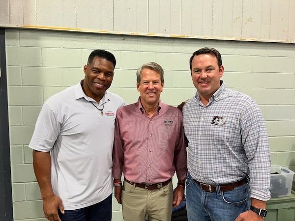 Herschel Walker, Gov. Brian Kemp and state Sen. Burt Jones pose for a picture. 