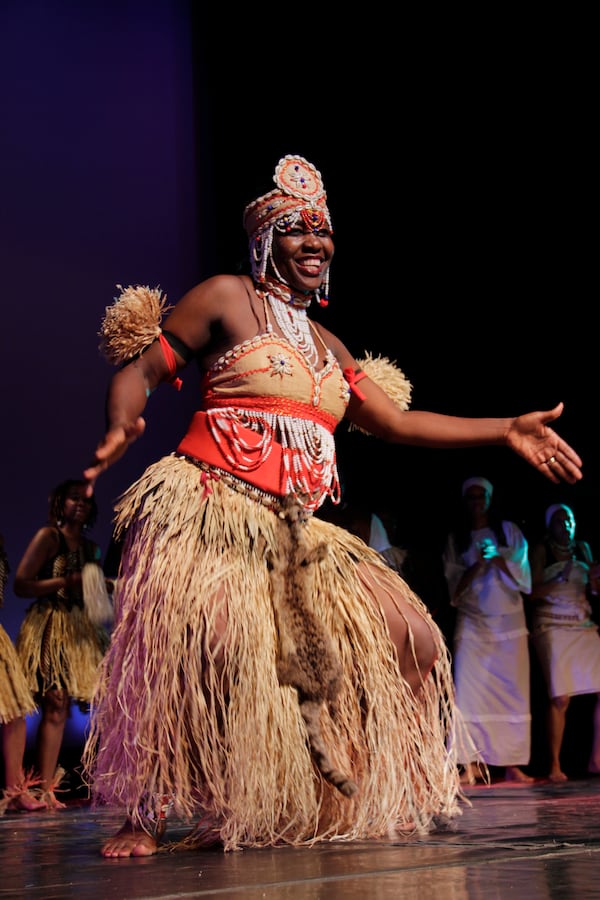 A dancer in the Manga African Dance company is obviously delighted to share her culture with the audience. 
Courtesy of Manga Dance Photograph by Photos Brothers.