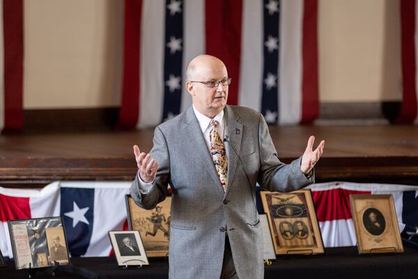 Presidential historian Larry Cook urged visitors at the high school that Jimmy and Rosalynn Carter attended to take the "Carter challenge." “Do something nice for somebody that needs it,” Cook said. “If you have someone who needs a phone call, make the phone call. If somebody needs a visit, go make that visit.” (Arvin Temkar / arvin.temkar@ajc.com)