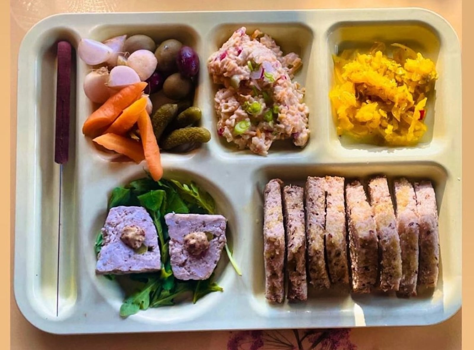 The snack tray at Whoopsie's typically features a few pickled items, a terrine, pimento cheese and toast, but items change often. July 23, 2023 (Credit: Whoopsie's)