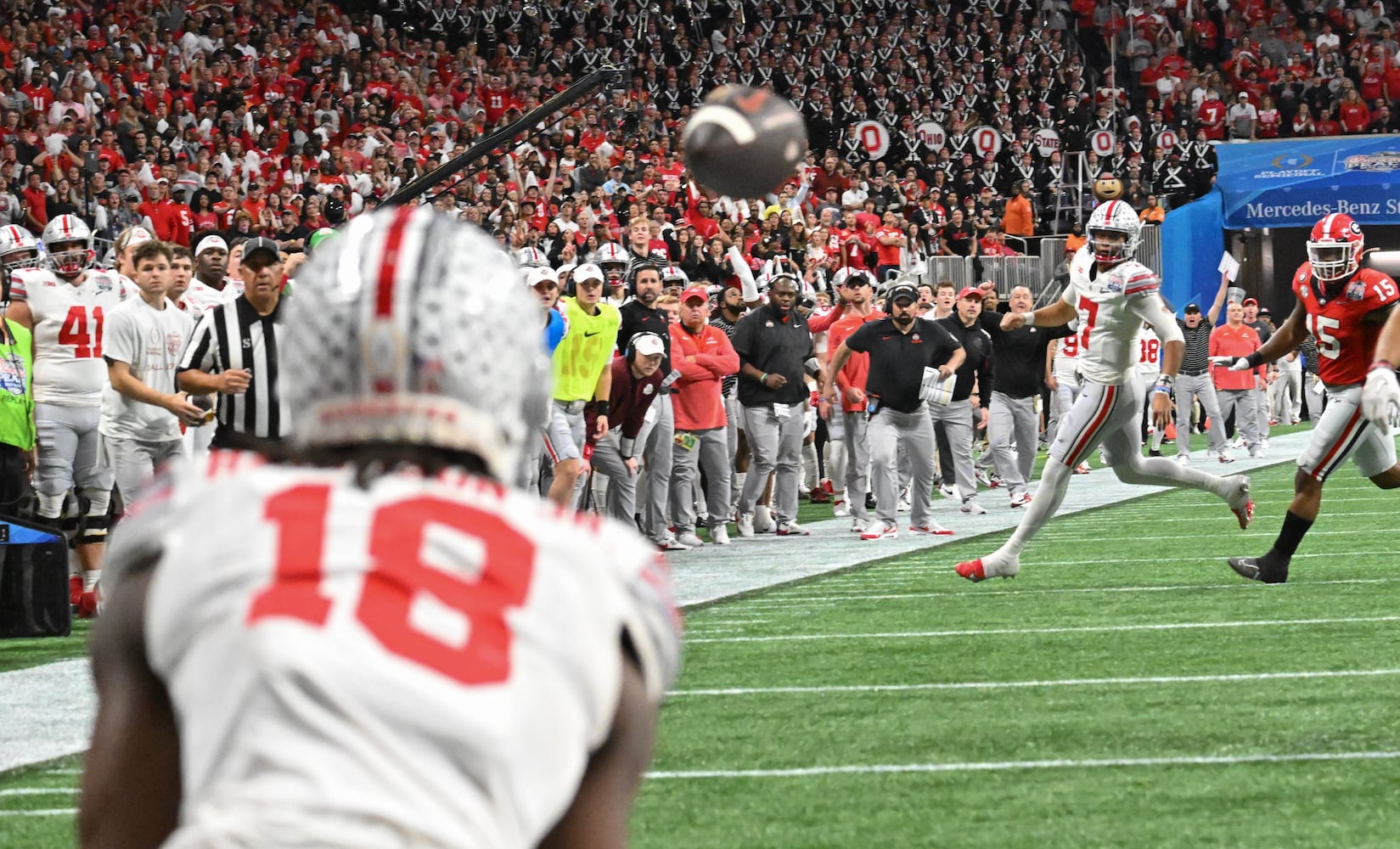 Ohio State Buckeyes wide receiver Marvin Harrison Jr. (18) catches a pass from quarterback C.J. Stroud (7) for a touchdown during the second quarter of the College Football Playoff Semifinal between the Georgia Bulldogs and the Ohio State Buckeyes at the Chick-fil-A Peach Bowl in Atlanta on Saturday, Dec. 31, 2022. (Hyosub Shin / Hyosub.Shin@ajc.com)