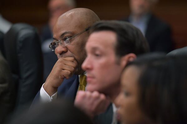 April 11, 2018 Atlanta - Lead prosecutor Clint Rucker (left) and Assistant District Attorney Adam Abbate listen during the Tex McIver murder trial at the Fulton County Courthouse on Wednesday, April 11, 2018. HYOSUB SHIN / HSHIN@AJC.COM