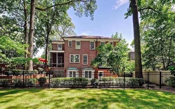 This grand historical Sherwood Forest/Ansley Park home is available for rent. The view shows the home from the back.