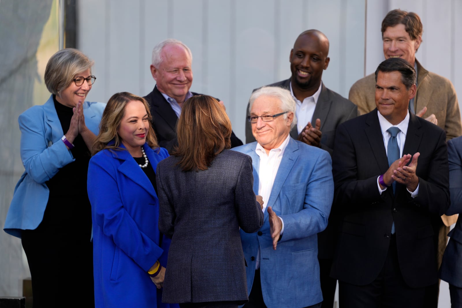 Democratic presidential nominee Vice President Kamala Harris talks with former Rep. Jim Greenwood, R-Pa., before she speaks during a campaign event at Washington Crossing Historic Park, Wednesday, Oct. 16, 2024, in Washington Crossing, Pa. (AP Photo/Matt Slocum)