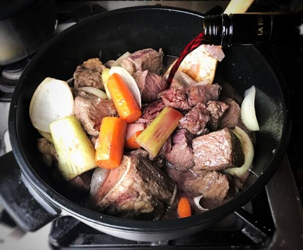 Adding wine to beef bourguignon.  (Leslie Brenner/Dallas Morning News/TNS) 

NO MAGAZINE SALES; MANDATORY CREDIT; NO SALES; INTERNET USE BY TNS CONTRIBUTORS ONLY