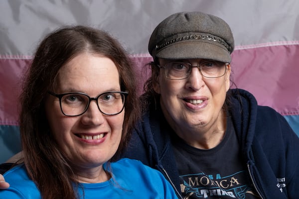 Monica Helms, (right) with her wife Darlene Wagner in their home in Cobb County. (Ben Gray / Ben@BenGray.com)