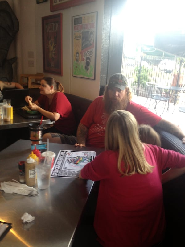 Jim Stacy conversing with old friends Oct. 10, 2014 at Pallookaville Fine Foods. CREDIT: Rodney Ho/rho@ajc.com