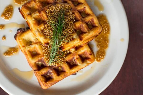 The Chicken in Waffles with a drizzle of maple mustard seeds. Photo credit: Tomas Espinoza