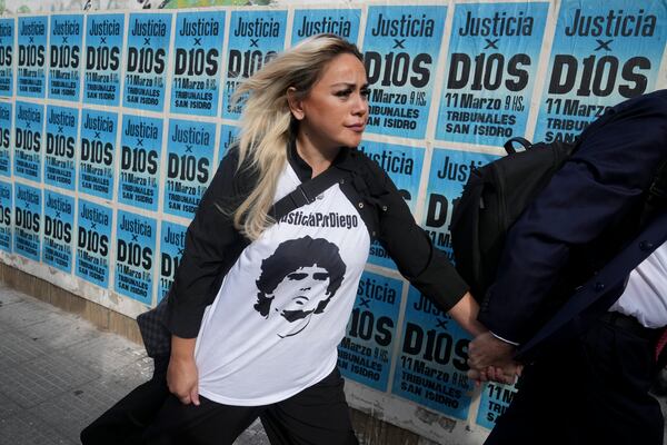 Veronica Ojeda, ex-partner of late soccer star Diego Maradona, arrives at court for the first day of a trial for alleged homicide by negligence against the medical team that treated Maradona, in San Isidro on the outskirts of Buenos Aires, Argentina, Tuesday, March 11, 2025. (AP Photo/Natacha Pisarenko)