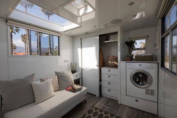 The washing machine and pull out bed in the Living Vehicle, at Cabrillo beach.  (Ricardo DeAratanha/Los Angeles Times/TNS)