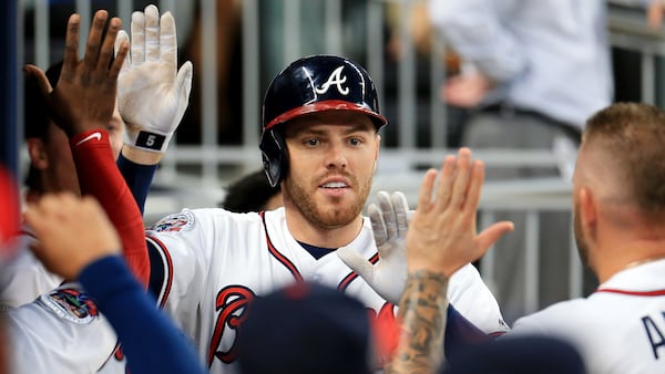 Braves' Freddie Freeman celebrates a home run during the first inning against the Washington Nationals Sept. 20, 2017, at SunTrust Park in Atlanta.