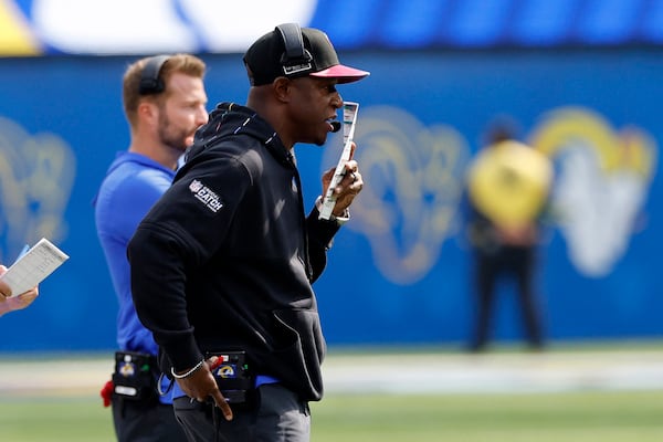 Los Angeles Rams defensive coordinator Raheem Morris, right, stands next to head coach Sean McVay on the sideline during the first half of an NFL football game against the Philadelphia Eagles Sunday, Oct. 8, 2023, in Inglewood, Calif. (AP Photo/Kevork Djansezian)