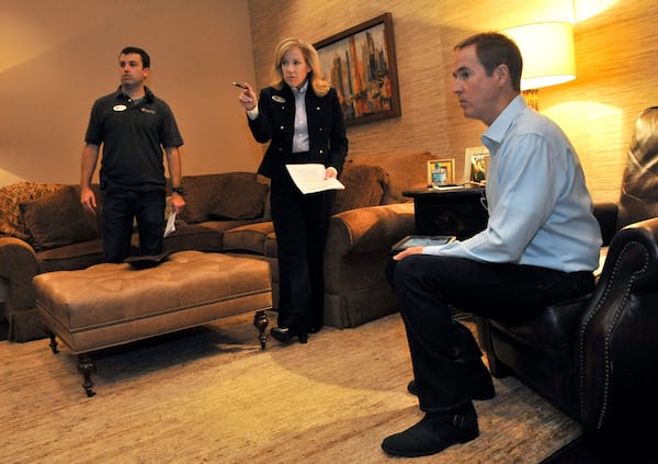 Andy Stanley (right) confers with church staff Julie Arnold (center) and Shane Stephens after his 9 a.m. worship service at North Point Community Church in Alpharetta.