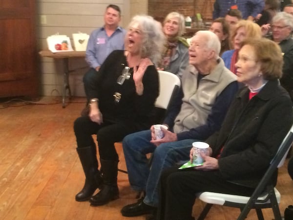 Paula Deen reacts to a comment from painting instructor James Richards Saturday morning in Plains as Rosalynn and Jimmy Carter listen. The morning class was part of “Painting, Paula and a President,” a daylong event in Plains that brought together the TV chef and the former president for a unique fundraiser. Photo by Jill Vejnoska jvejnoska@ajc.com