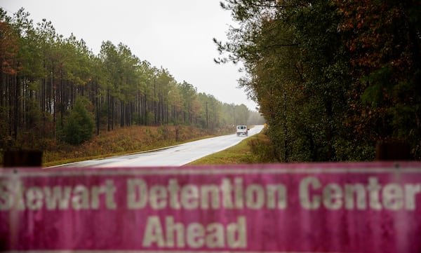 In this Nov. 15, 2019, photo, a detainee transport van travels the rural road back to the Stewart Detention Center in Lumpkin, Ga. The 1,700-bed facility was at 89% capacity on President Donald Trump's first day in office. (AP Photo file photo)