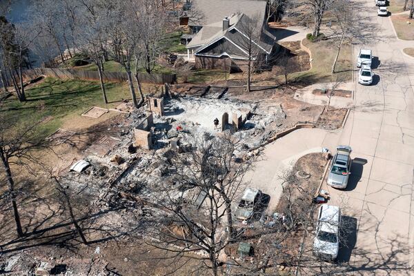 An aerial view of Andrine Shufran's burned home in the Hidden Oaks neighborhood in Stillwater, Okla., Monday, March 17, 2025, after wildfires burned through the area Friday. (AP Photo/Alonzo Adams)