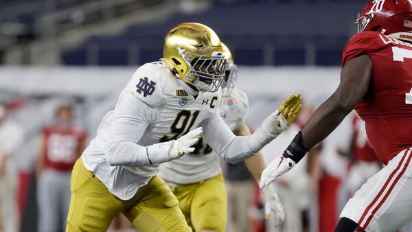 Notre Dame defensive lineman Adetokunbo Ogundeji (91) rushes against Alabama during the Rose Bowl Friday, Jan.1, 2021, in Arlington, Texas. (Michael Ainsworth/AP)