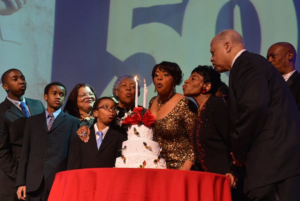 Members of the King Family and blow at the candles on the birthday cake of Martin Luther King Jr. at their 2013 Salute to Greatness Dinner. Most of the events this year will be virtual.