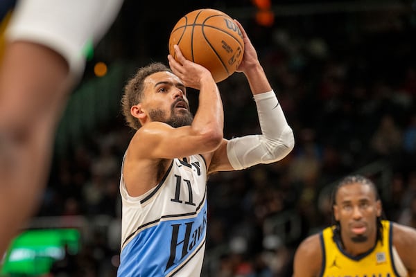 Atlanta Hawks guard Trae Young (11) makes a free throw during the second half of an NBA basketball game between the Indiana Pacers, Saturday, March 8, 2025, in Atlanta. (AP Photo/Erik Rank)