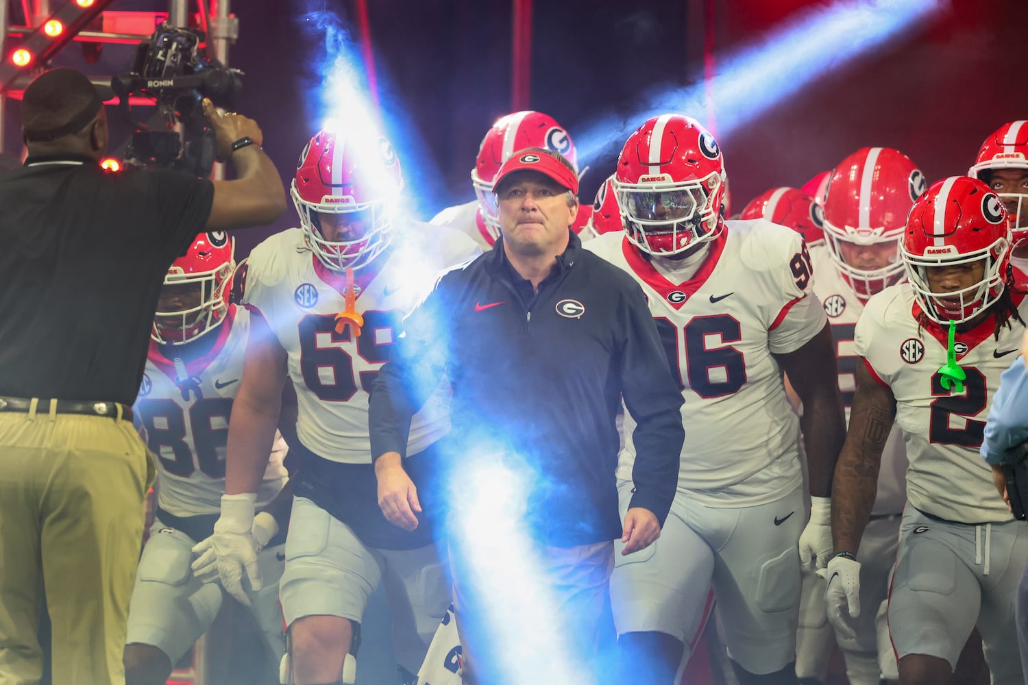 Georgia Bulldogs head coach Kirby Smart leads his team onto the field to face the Alabama Crimson Tide in the SEC Championship football game at the Mercedes-Benz Stadium in Atlanta, on Saturday, December 2, 2023. (Jason Getz / Jason.Getz@ajc.com)