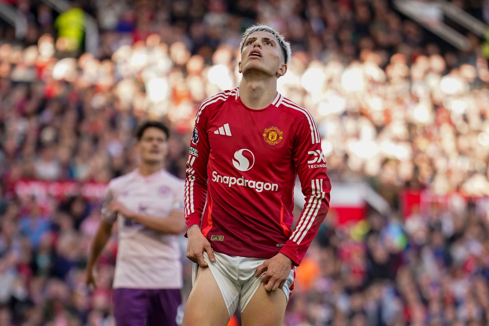 Manchester United's Alejandro Garnacho reacts after missing a chance to score during the English Premier League soccer match between Manchester United and Brentford at Old Trafford stadium in Manchester, England, Saturday, Oct. 19, 2024. (AP Photo/Dave Thompson)