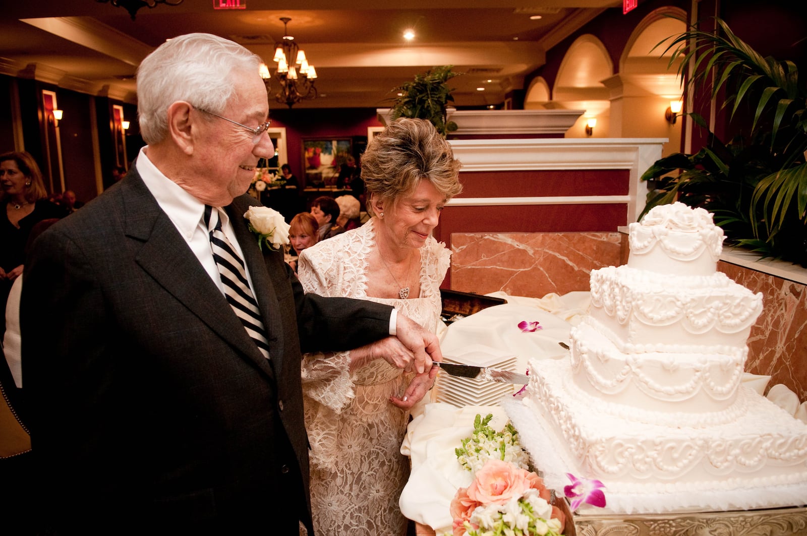 Joy and Art Chase cut their wedding cake after their Saturday night, February 28, 2009, ceremony at Parc at Buckhead. The two 80-somethings, both widows, met when they moved into the elegant high-rise for seniors. Neither was looking to marry again, but they feel grateful to have found each other. AJC file photo: Tim Harman