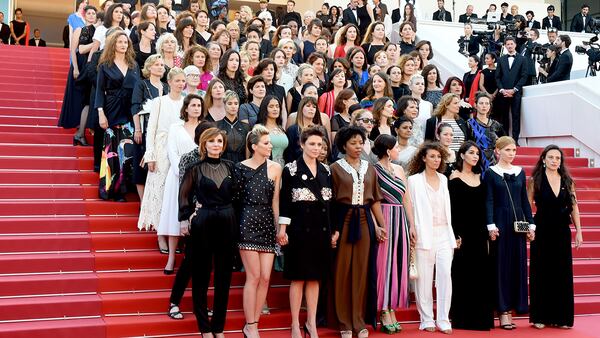 CANNES, FRANCE - MAY 12:  Jury head Cate Blanchett with other filmmakers reads a statement on the steps of the red carpet in protest of the lack of female filmmakers honored throughout the history of the festival at the screening of "Girls Of The Sun (Les Filles Du Soleil)" during the 71st annual Cannes Film Festival at the Palais des Festivals on May 12, 2018 in Cannes, France. Only 82 films in competition in the official selection have been directed by women since the inception of the Cannes Film Festival whereas 1,645 films in the past 71 years have been directed by men.  (Photo by Antony Jones/Getty Images)