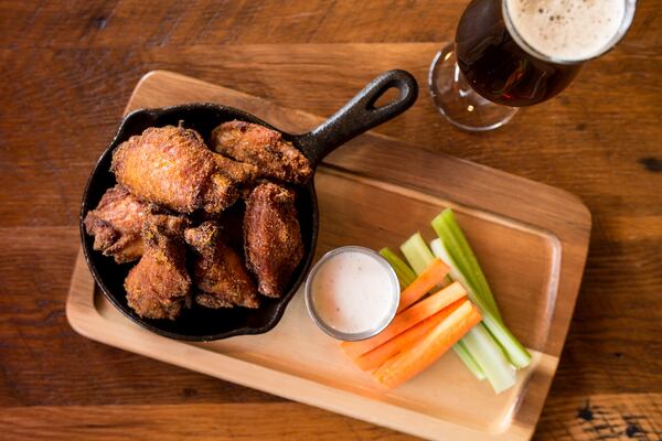 Ten Spice Wings with blue cheese ranch and crisp vegetables. Photo credit- Mia Yakel.