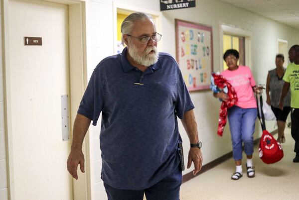 Pastor Bobby D. Paul Jr. (front) walks a group of shelter seekers to a room inside Family Worship Center in Albany, Wednesday October 10, 2018. Hurricane Michael has been upgraded to a Category 4 hurricane and will will impact South and Middle Georgia. (Alyssa Pointer/Alyssa.Pointer@ajc.com)