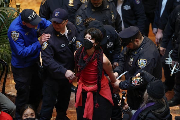 New York Police officers arrest a demonstrator from the group, Jewish Voice for Peace, who protested inside Trump Tower in support of Columbia graduate student Mahmoud Khalil, Thursday, March 13, 2025, in New York. (AP Photo/Yuki Iwamura)