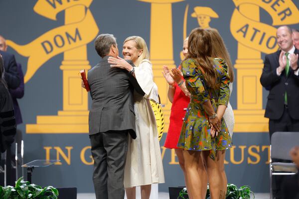 Gov. Brian Kemp hugs his wife Marty after being sworn in for his second term at his inauguration ceremony at Georgia State convocation Center on Thursday, January 12, 2023.  (Natrice Miller/natrice.miller@ajc.com)  